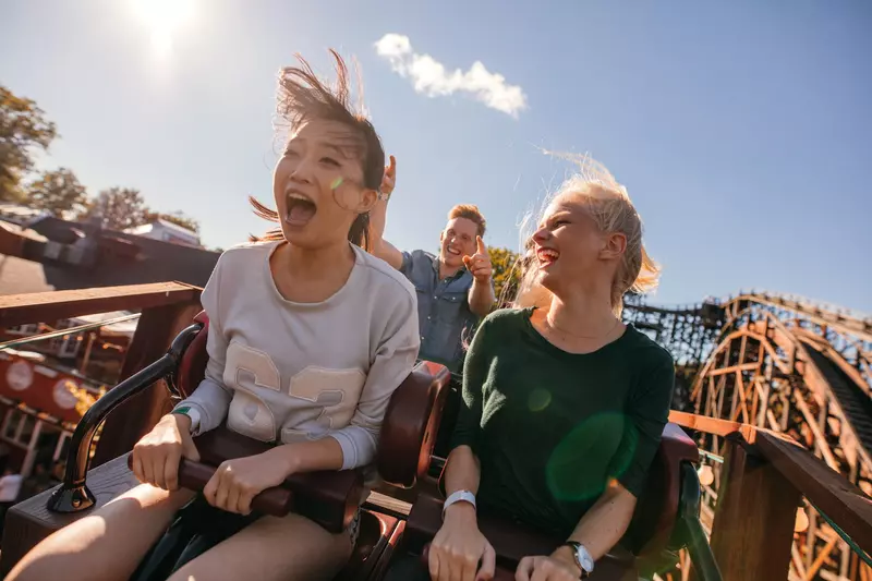 Young friends on a roller coaster.