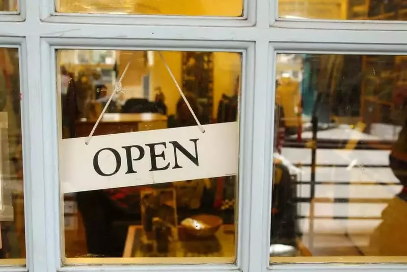 open sign hanging on door of store in Pigeon Forge TN